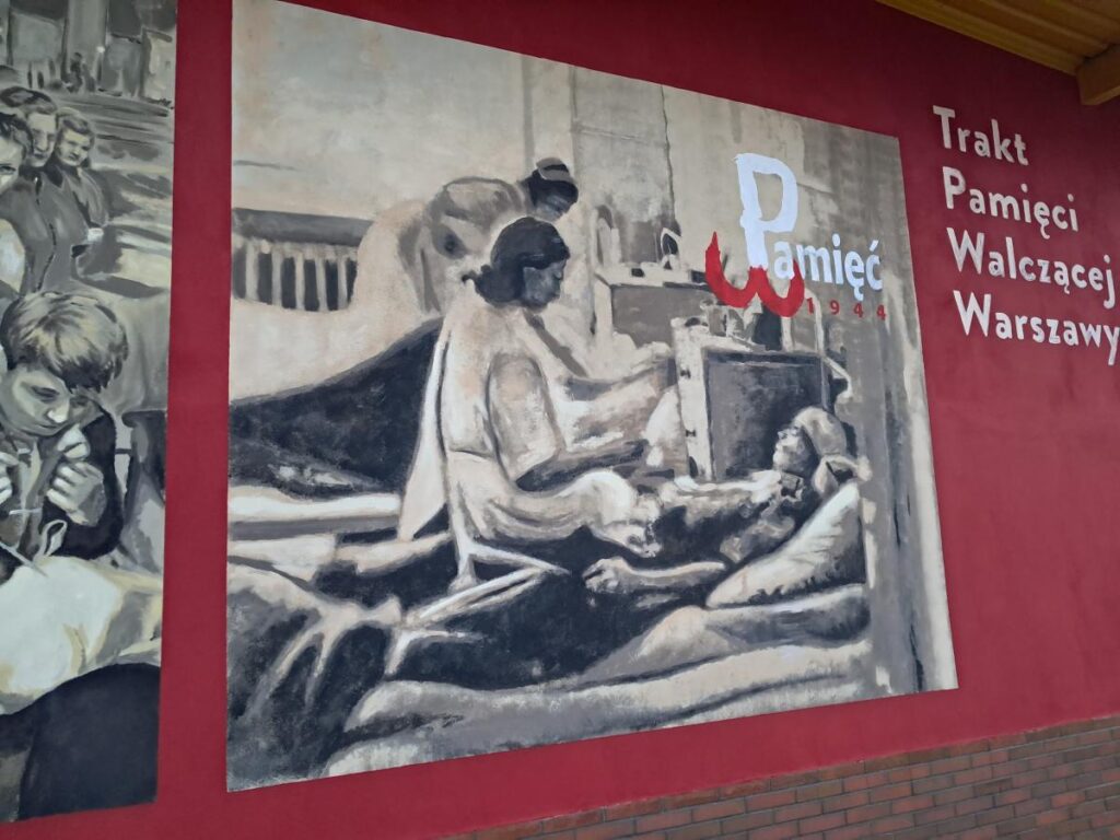 Wykonanie muralu historycznego na ścianie budynku portierni Zakładów Akumulatorowych ZAP Sznajder Batterien S.A. przy ul. Warszawskiej w Piastowie. — 1